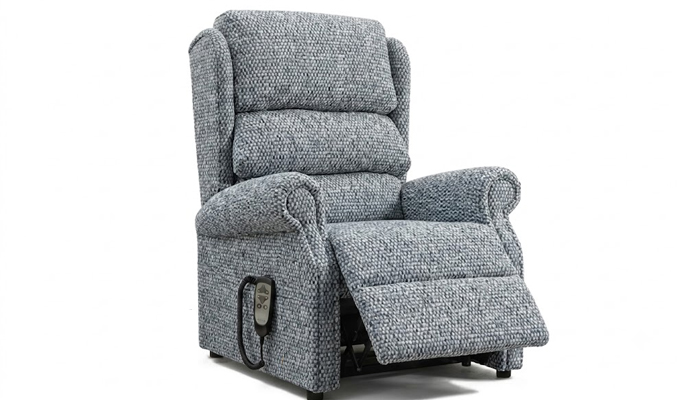 Petite electric riser recliner chair in the fully raised stand-up position.